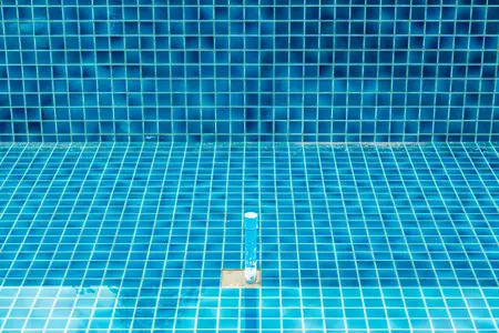 Swimming pool resurfacing customer pool, resurfaced with blue glass tile